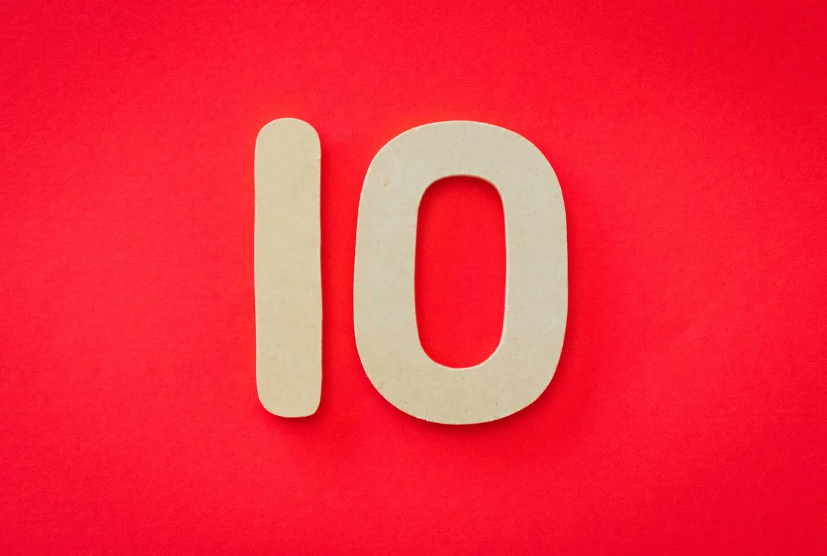 Large cream-colored numbers "10" on a bright red background