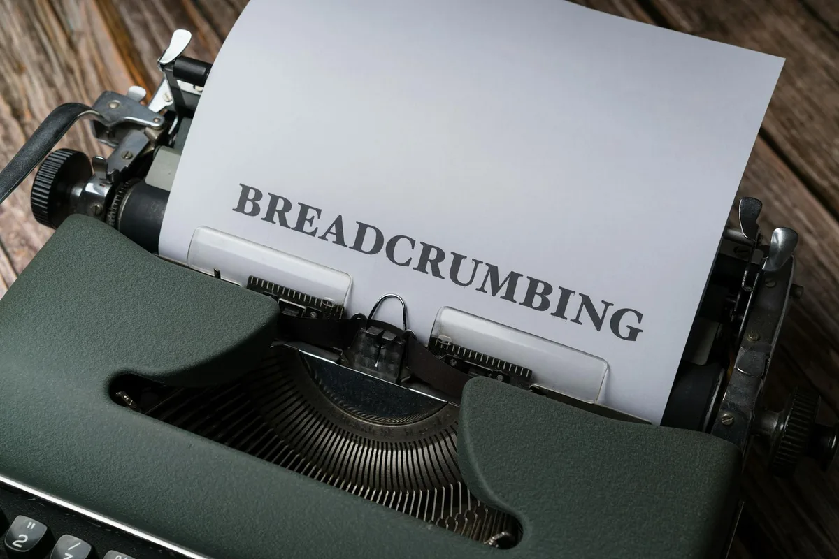 Vintage typewriter with "BREADCRUMBING" text on white paper
